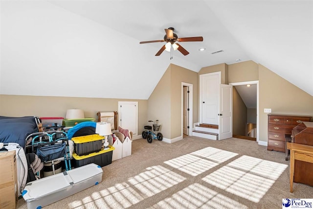 bedroom featuring ceiling fan, vaulted ceiling, and light carpet