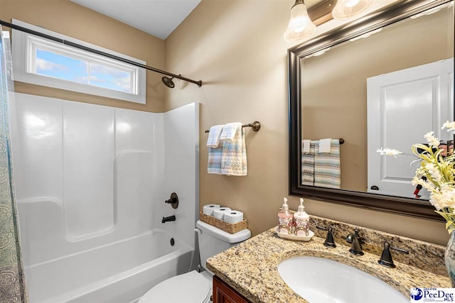 full bathroom featuring vanity, shower / bathtub combination, and toilet