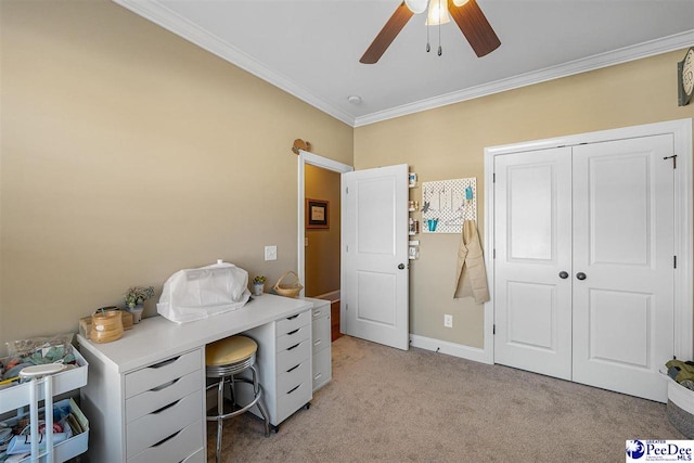 carpeted office featuring ceiling fan and ornamental molding