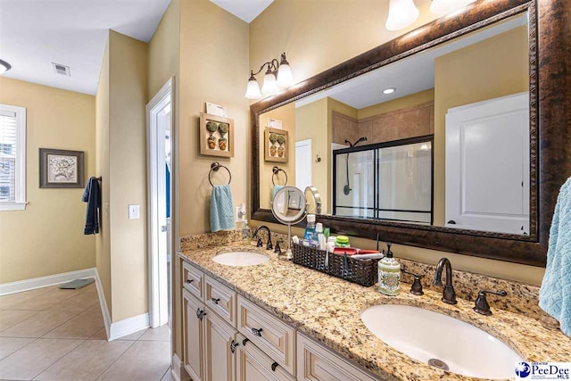 bathroom with vanity, tile patterned floors, and walk in shower