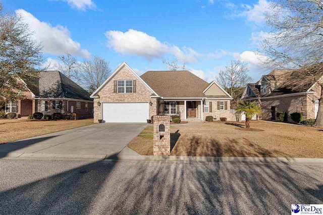 view of front property with a garage and a front lawn