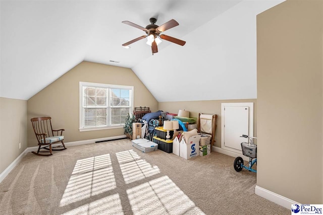 bedroom featuring vaulted ceiling, light colored carpet, and ceiling fan