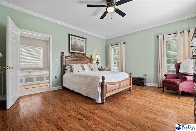 526 Shannon Rd, Marion, SC 29571 - bedroom with crown molding, baseboards, multiple windows, and wood finished floors