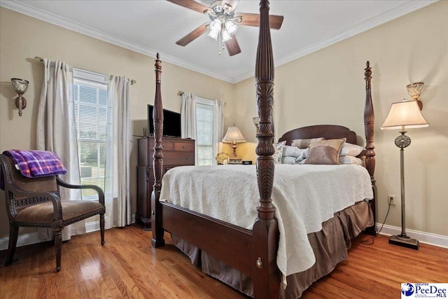 526 Shannon Rd, Marion, SC 29571 - bedroom featuring wood finished floors, ornamental molding, and multiple windows