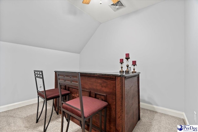 526 Shannon Rd, Marion, SC 29571 - bar with light carpet, visible vents, baseboards, and vaulted ceiling