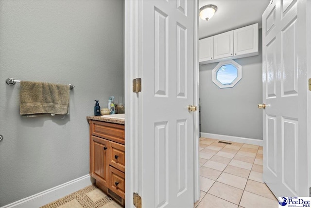 526 Shannon Rd, Marion, SC 29571 - bathroom with tile patterned floors, vanity, and baseboards