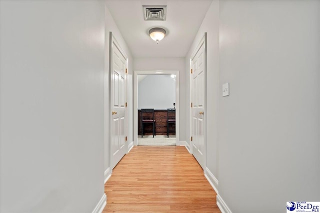 526 Shannon Rd, Marion, SC 29571 - corridor featuring visible vents, baseboards, and light wood finished floors
