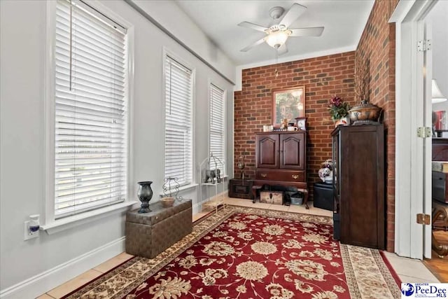 526 Shannon Rd, Marion, SC 29571 - interior space with brick wall, baseboards, and a ceiling fan