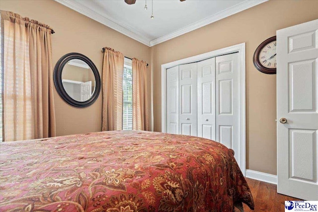 526 Shannon Rd, Marion, SC 29571 - bedroom with crown molding, a closet, baseboards, and wood finished floors