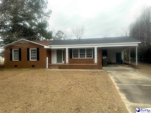 ranch-style home with a carport