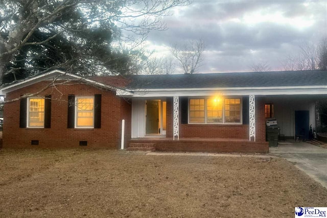 single story home featuring a carport