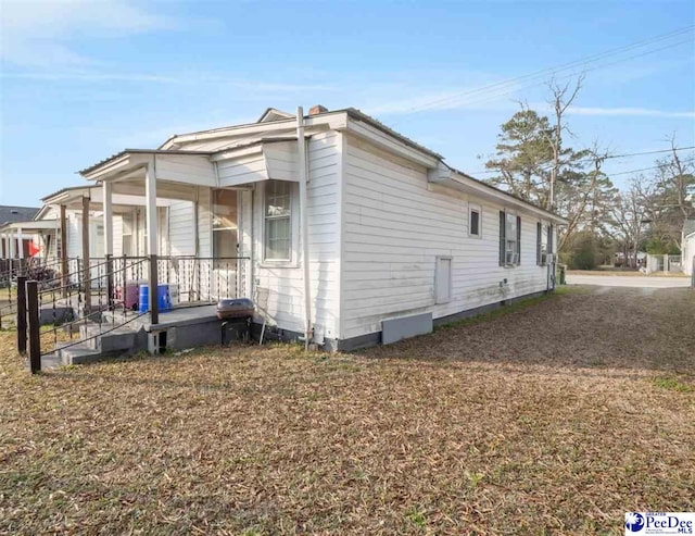 view of home's exterior featuring covered porch