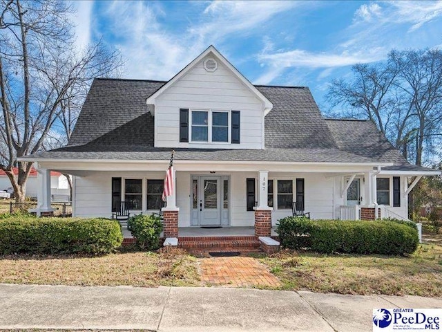 view of front facade featuring a porch and a shingled roof