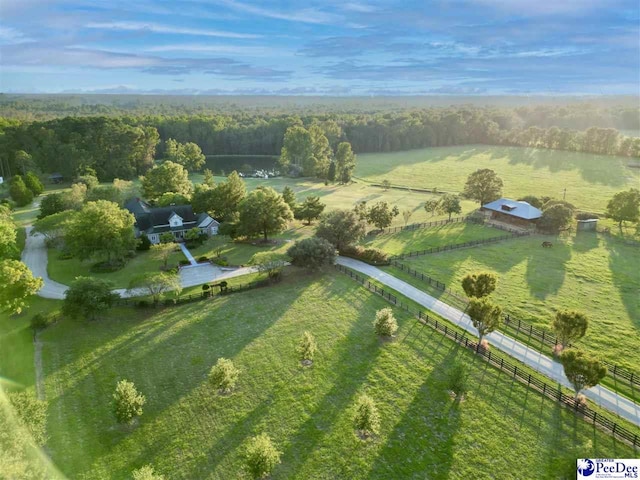 birds eye view of property with a rural view