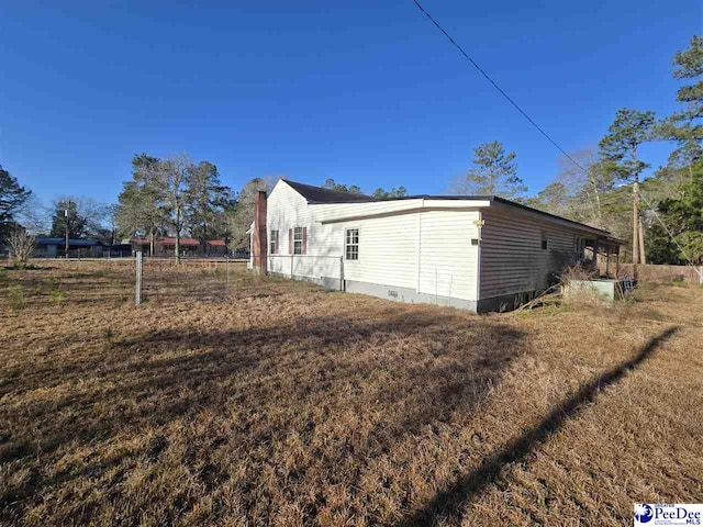 view of home's exterior with crawl space