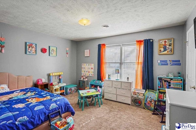 carpeted bedroom with a textured ceiling