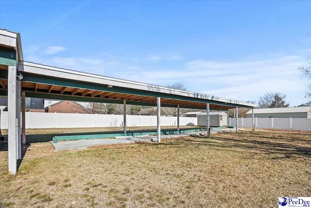 exterior space with a yard and a storage shed