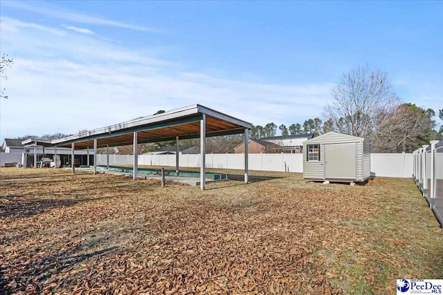 view of yard with a storage unit