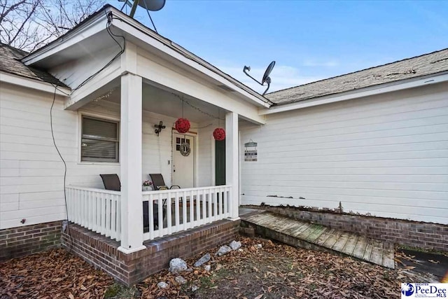 doorway to property featuring a porch