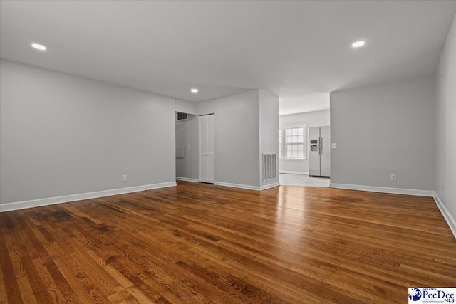 1933 3rd Loop Unit A, Florence, SC 29501 - unfurnished living room with wood finished floors, recessed lighting, and baseboards