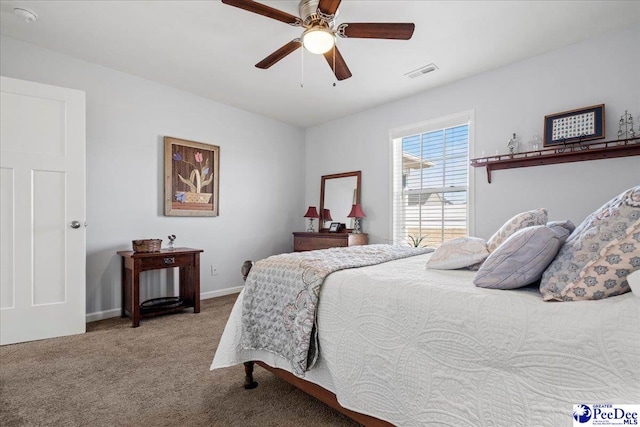 bedroom with light carpet, baseboards, visible vents, and a ceiling fan