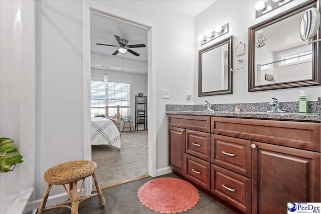 full bath featuring ceiling fan, a sink, ensuite bath, and double vanity