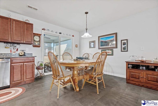 dining room featuring baseboards and visible vents