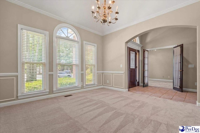 3401 Sussex Ct, Florence, SC 29501 - unfurnished room featuring arched walkways, carpet, a chandelier, ornamental molding, and wainscoting