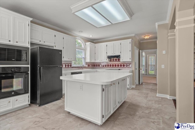 3401 Sussex Ct, Florence, SC 29501 - kitchen featuring black appliances, light countertops, white cabinetry, ornamental molding, and under cabinet range hood