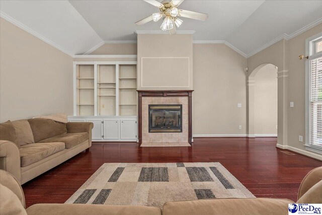 3401 Sussex Ct, Florence, SC 29501 - living area with arched walkways, lofted ceiling, ceiling fan, wood finished floors, and a tiled fireplace