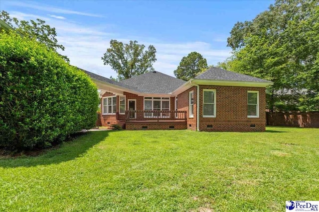 3401 Sussex Ct, Florence, SC 29501 - back of property with crawl space, brick siding, a wooden deck, and roof with shingles