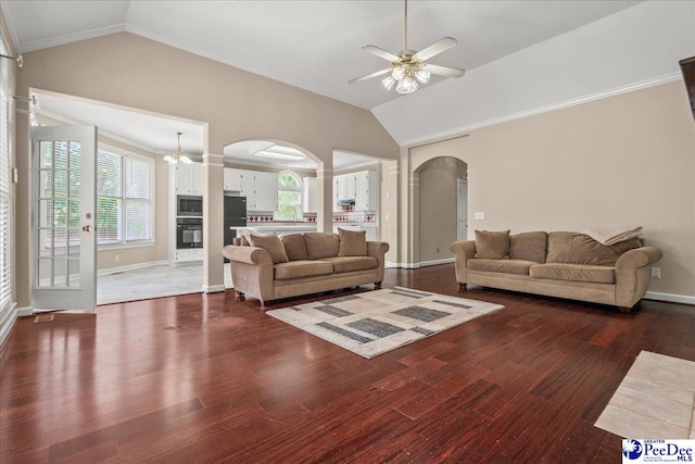 3401 Sussex Ct, Florence, SC 29501 - living room with arched walkways, vaulted ceiling, ceiling fan, wood finished floors, and a chandelier
