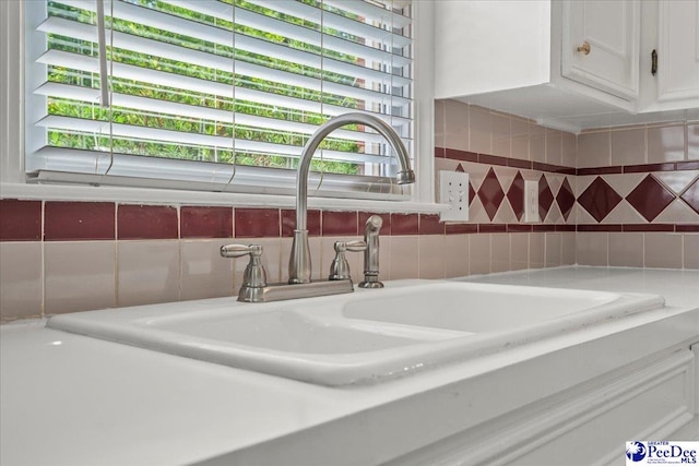 3401 Sussex Ct, Florence, SC 29501 - detailed view of white cabinets, decorative backsplash, and light countertops