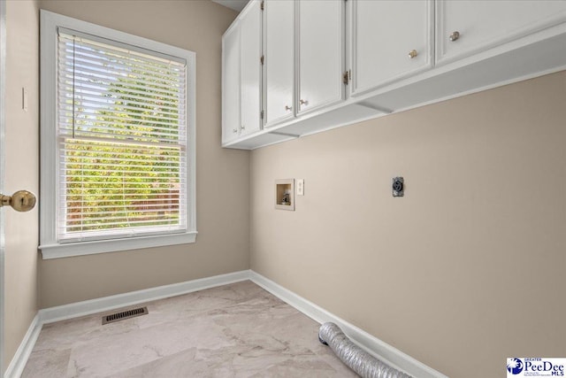 3401 Sussex Ct, Florence, SC 29501 - washroom featuring cabinet space, hookup for an electric dryer, hookup for a washing machine, and light marble finish flooring