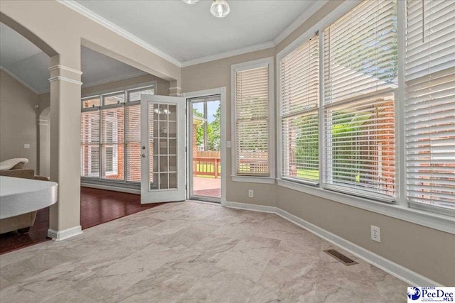 3401 Sussex Ct, Florence, SC 29501 - unfurnished sunroom featuring crown molding and arched walkways