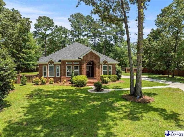 3401 Sussex Ct, Florence, SC 29501 - view of front of home with brick siding and view of wooded area