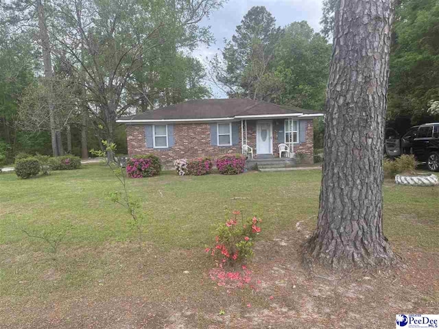 2122 Williams Gibbons Rd, Turbeville, SC 29162 - view of front of property with a front lawn and brick siding