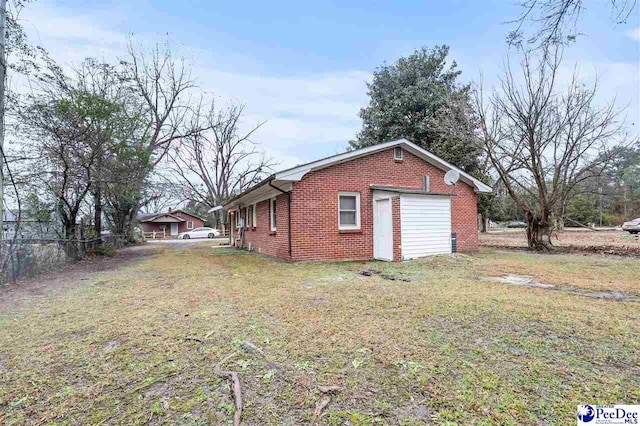 view of outdoor structure featuring a lawn