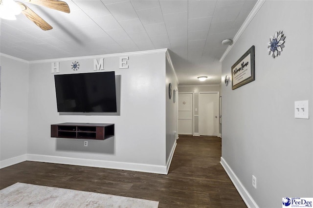 unfurnished living room featuring dark wood-type flooring, ceiling fan, and ornamental molding