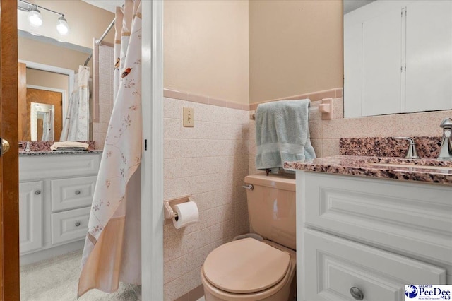 1040 Left Bank Dr, Florence, SC 29501 - full bath with vanity, toilet, a shower with shower curtain, and tile walls