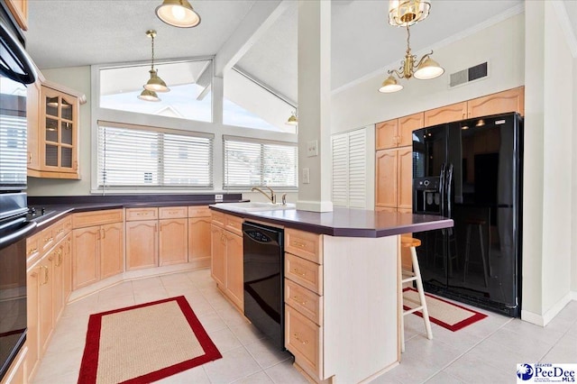 1040 Left Bank Dr, Florence, SC 29501 - kitchen with light brown cabinetry, black appliances, dark countertops, a sink, and light tile patterned floors