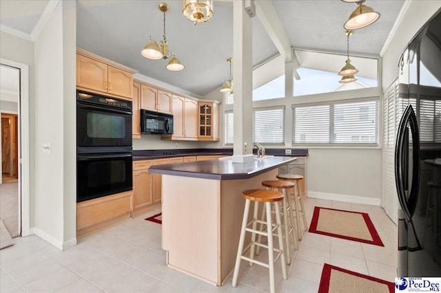 1040 Left Bank Dr, Florence, SC 29501 - kitchen featuring black appliances, light brown cabinetry, light tile patterned flooring, dark countertops, and a kitchen bar