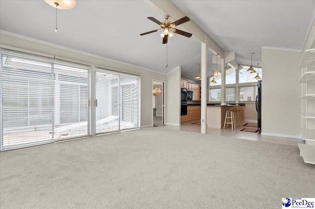1040 Left Bank Dr, Florence, SC 29501 - unfurnished living room with light colored carpet, baseboards, a ceiling fan, vaulted ceiling, and crown molding