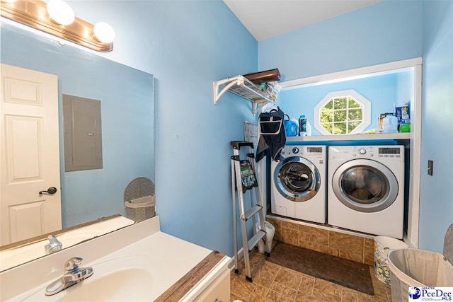 4128 W Pelican Ln, Florence, SC 29501 - laundry area with independent washer and dryer, electric panel, and stone finish floors