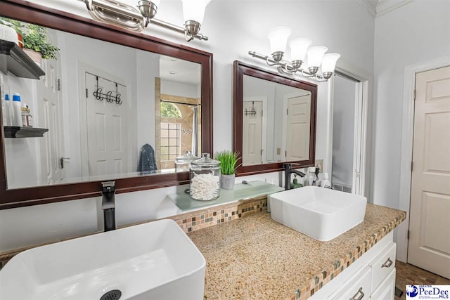 4128 W Pelican Ln, Florence, SC 29501 - bathroom featuring double vanity and a chandelier