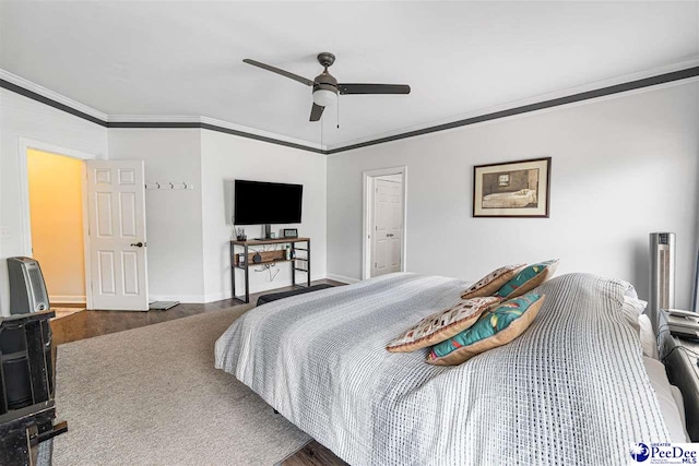 4128 W Pelican Ln, Florence, SC 29501 - bedroom featuring ornamental molding, baseboards, a ceiling fan, and wood finished floors