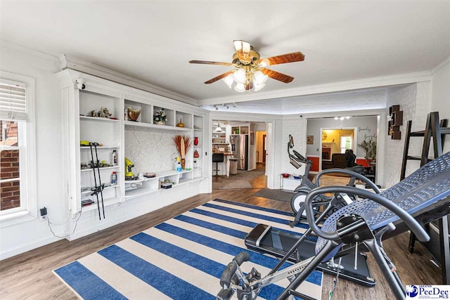 4128 W Pelican Ln, Florence, SC 29501 - exercise room with crown molding, wood finished floors, ceiling fan, and baseboards