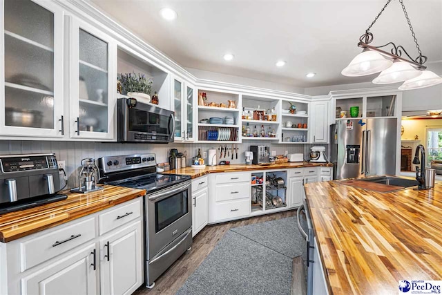 4128 W Pelican Ln, Florence, SC 29501 - kitchen featuring wood counters, stainless steel appliances, open shelves, and recessed lighting