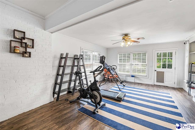 4128 W Pelican Ln, Florence, SC 29501 - workout area featuring wood finished floors, ornamental molding, ceiling fan, baseboards, and brick wall