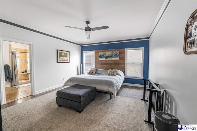 4128 W Pelican Ln, Florence, SC 29501 - carpeted bedroom with crown molding, baseboards, a ceiling fan, and ensuite bath